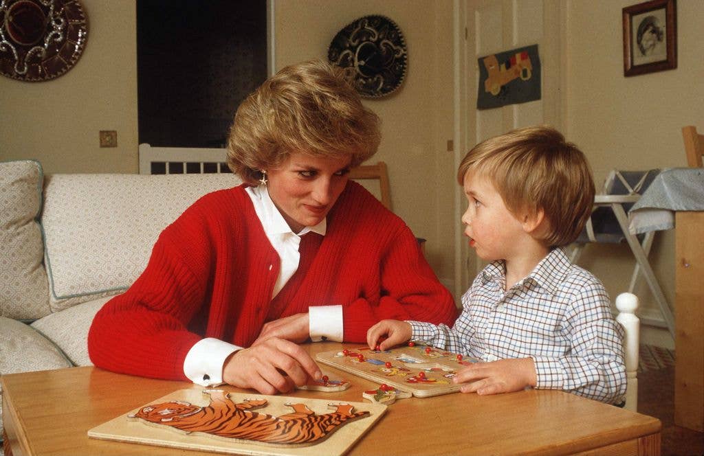 Diana helping William with a puzzle at home