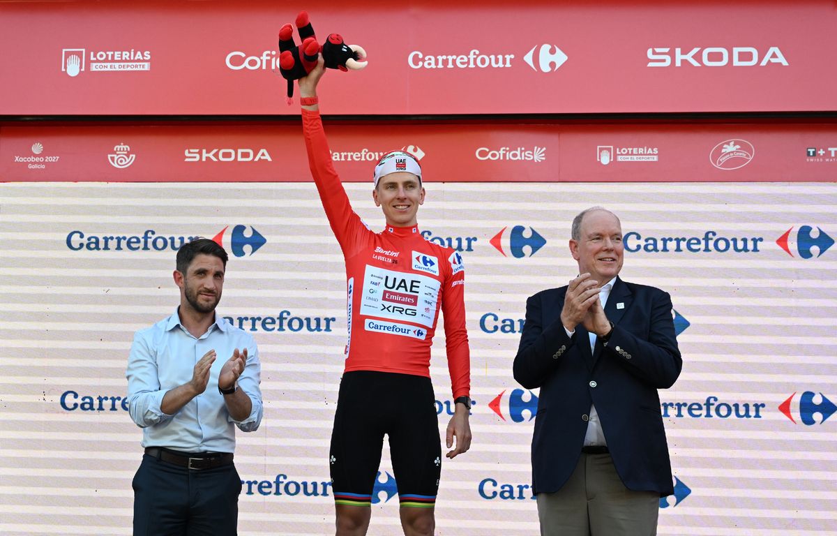 Prince Albert II of Monaco applauds Tadej Pogačar as the Slovenian cyclist celebrates on the podium in the overall leader’s red jersey following Stage 2 of La Vuelta 2026 in Manosque, France, on August 23, 2026.