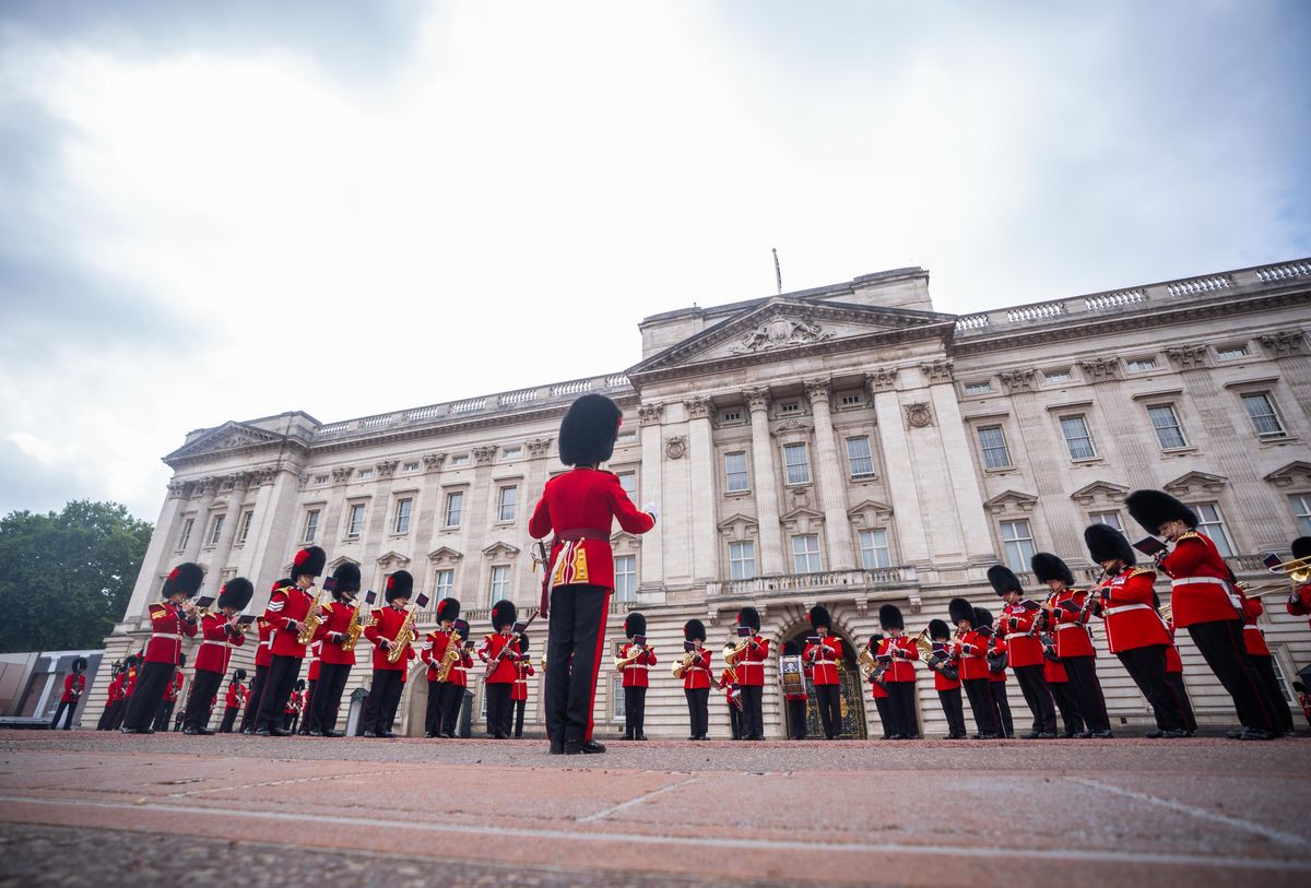 Members of Number 12 Company Irish Guards march with the Band of the Coldstream Guards from Wellington Barracks to Buckingham Palace.