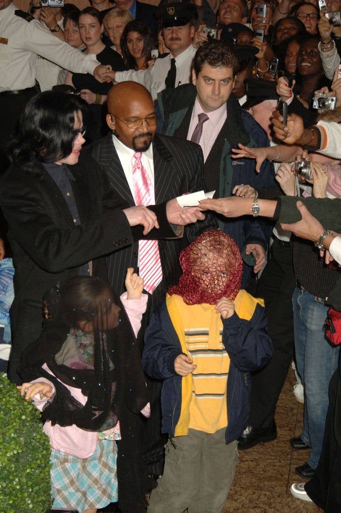 Michael Jackson with his children, Prince and Paris, visit Harrods in London. 2005
