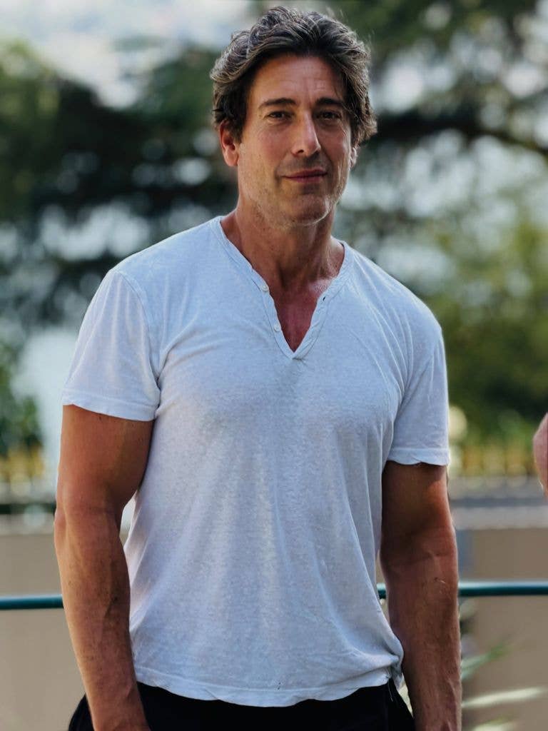 David wearing a casual t-shirt and ruffled hair