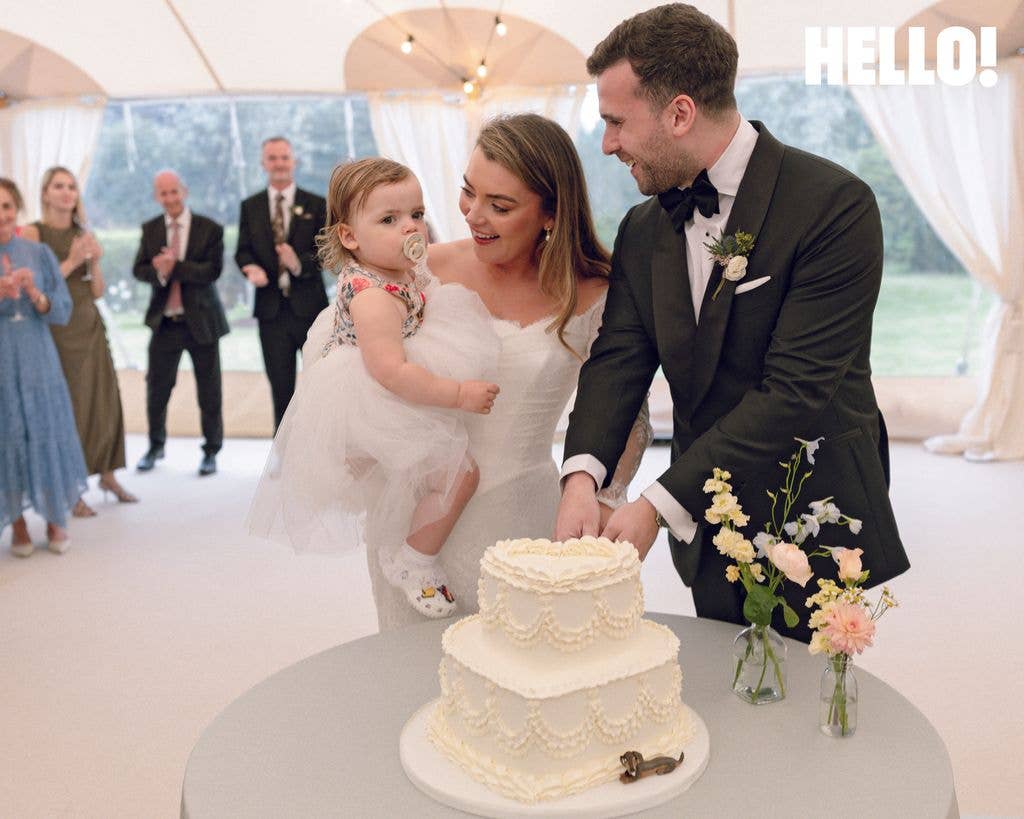 Rosie Kelly Smith and Steve White cut the cake