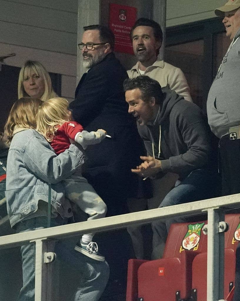 Ryan Reynolds (centre) celebrates with Blake Lively and their child 