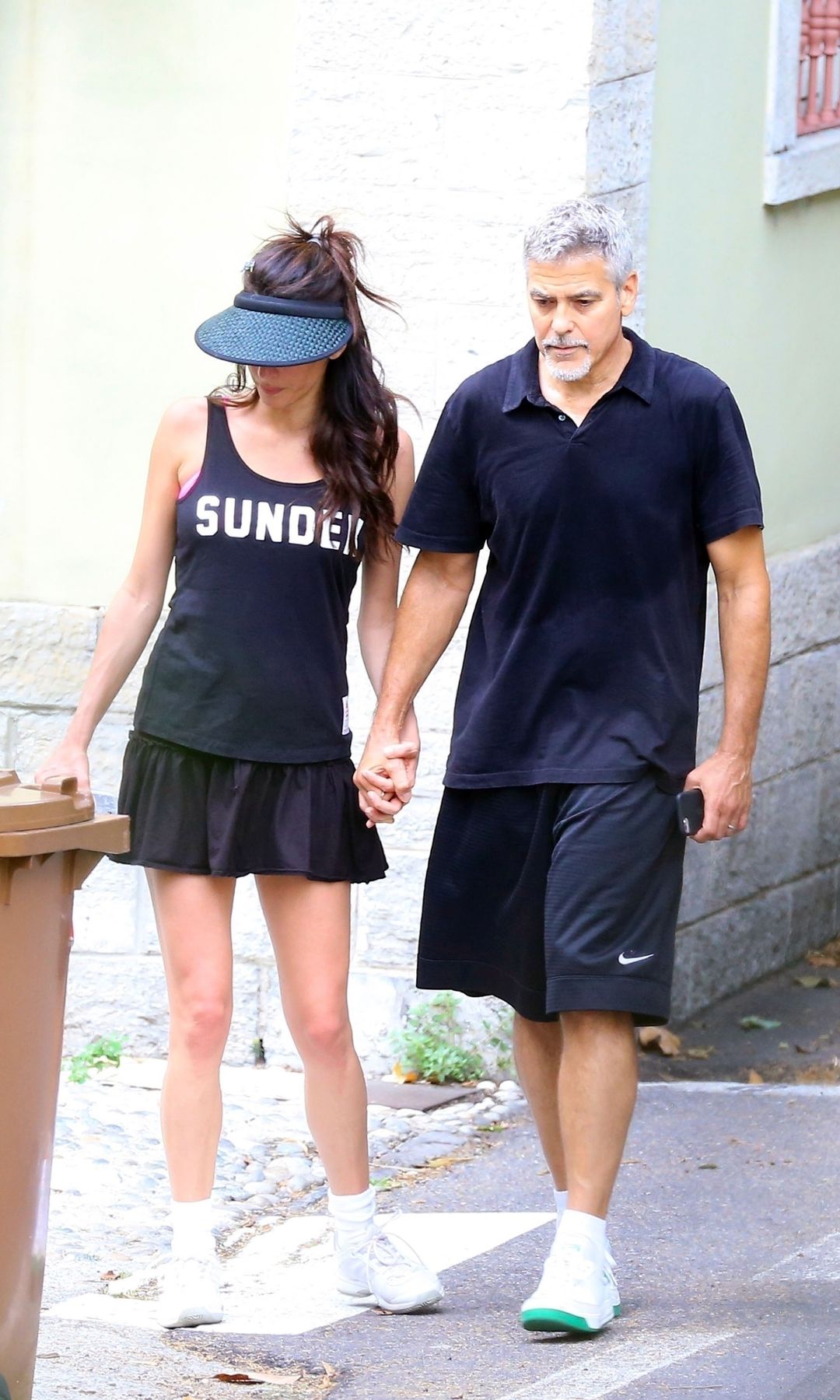 George Clooney and his wife Amal Clooney looking sporty after enjoying playing tennis match together before returning Home in Laglio, Italy.