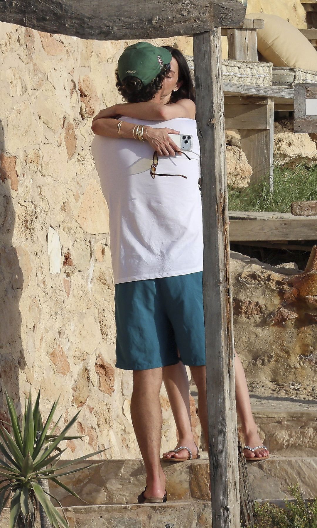 The couple shared a kiss by the sea