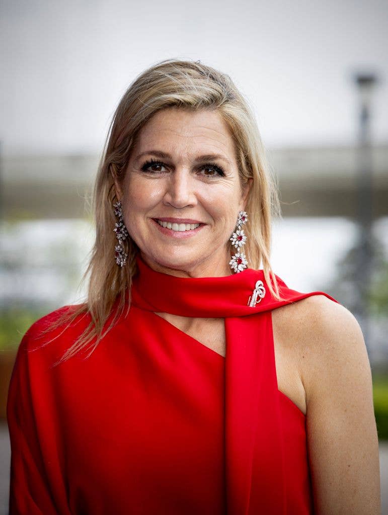 Queen Maxima close up in red jumpsuit 