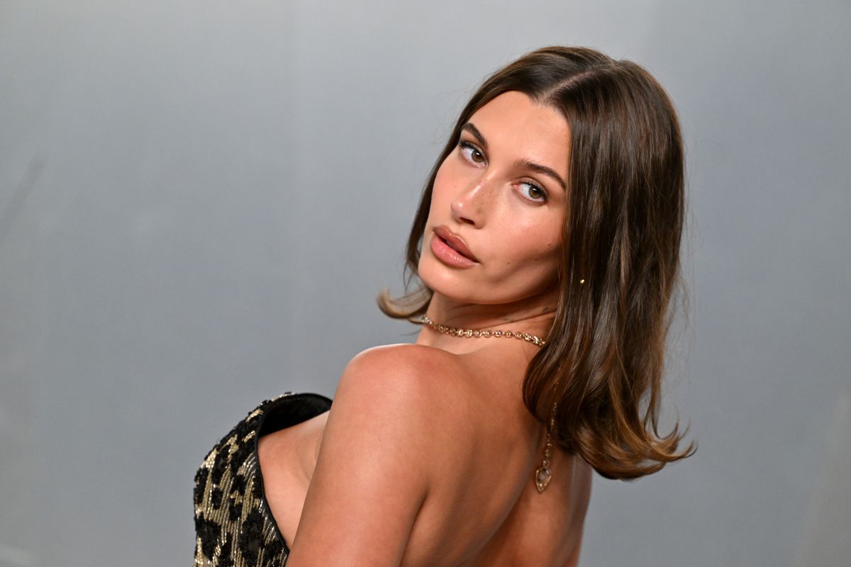 Hailey Bieber shows off her curves in a candy pink bikini embracing summer's minimalist swimwear trend