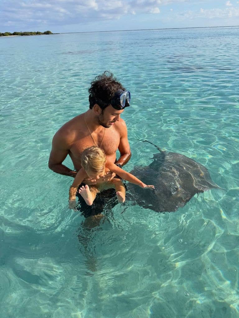 Gisele's husband with their young son