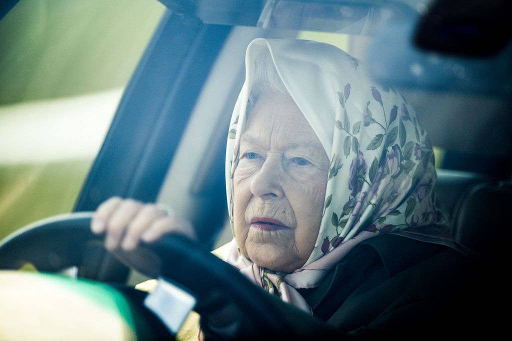 Queen Elizabeth II drives her Range Rover car 