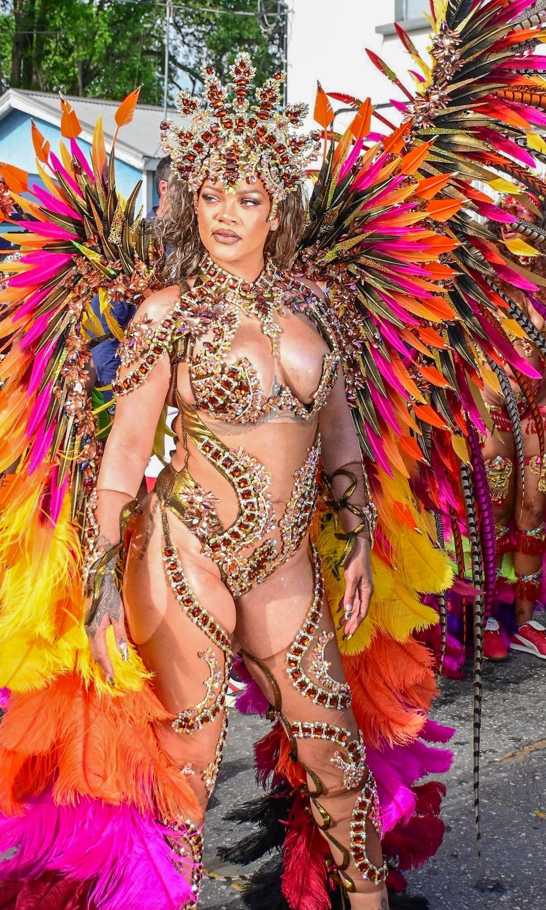 Singer Rihanna Stuns at Carnival Festival In Barbados As She Poses With Police Officers In Her 2024 Outfit Consisting of Bewejeled Bra Head- To-Toe.