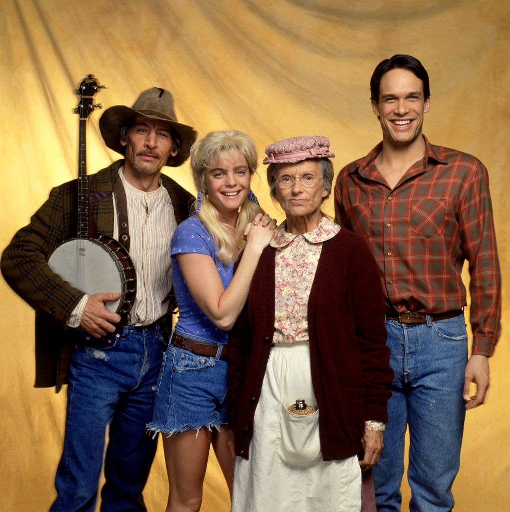 American actor Jim Varney (1949 - 2000), actress Erika Eleniak, actress Cloris Leachman (1926 - 2021) and actor Diedrich Bader pose in costume for the 1993 comedy film The Beverly Hillbillies in Los Angeles, California, circa 1993.