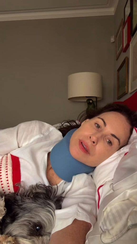 Minnie Driver speaks to the camera from the bed of her London home in a neck brace, shared on Instagram
