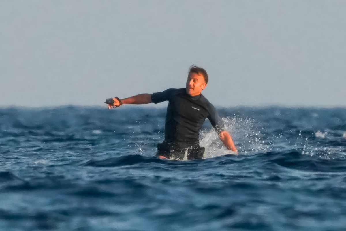 He was all smiles as he fell off his surfboard