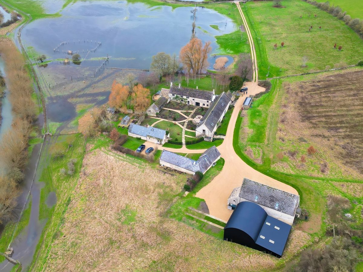 Ellen DeGeneres and her wife Portia De Rossi's new life in Britain has quickly become a washout after flash flooding hit the picturesque Cotswolds village where they recently moved.