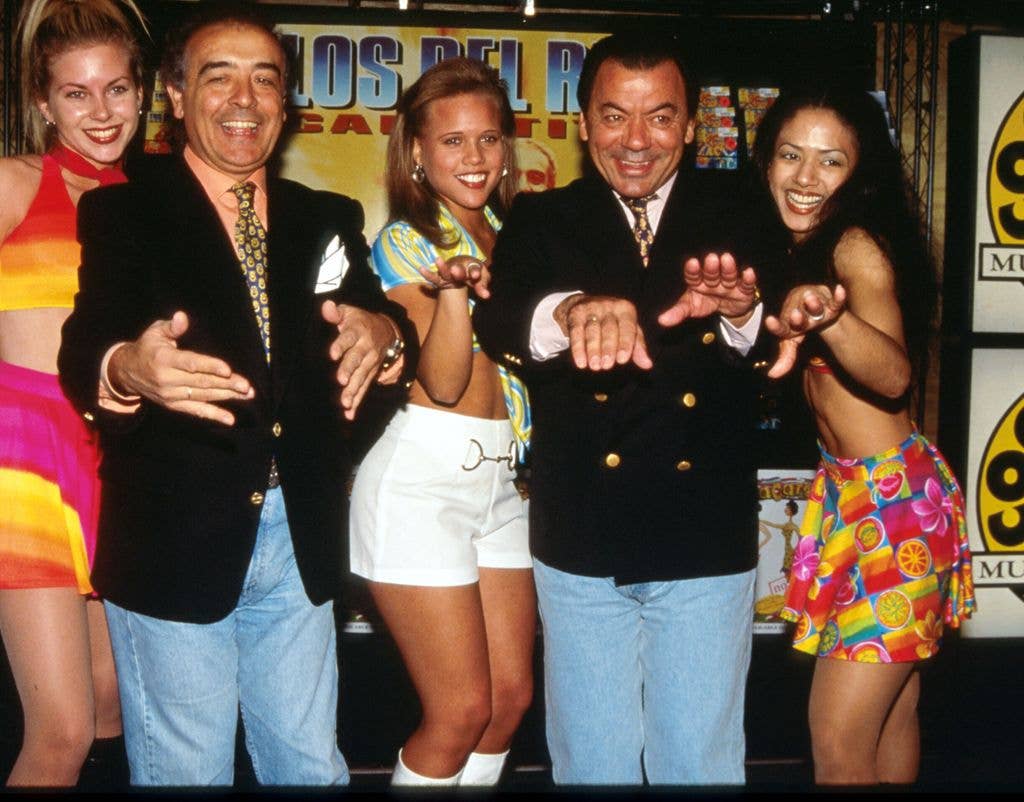 Los Del Rio's Raphael Ruiz and Antonio Romero stand with dancers at a Coconuts music store October 15, 1996 in New York City. Los Del Rio had recorded over 30 albums of traditional Spanish music, until they recorded the worldwide smash hit the "Macarena" which made Billboard's Hot 100 chart for seven weeks.