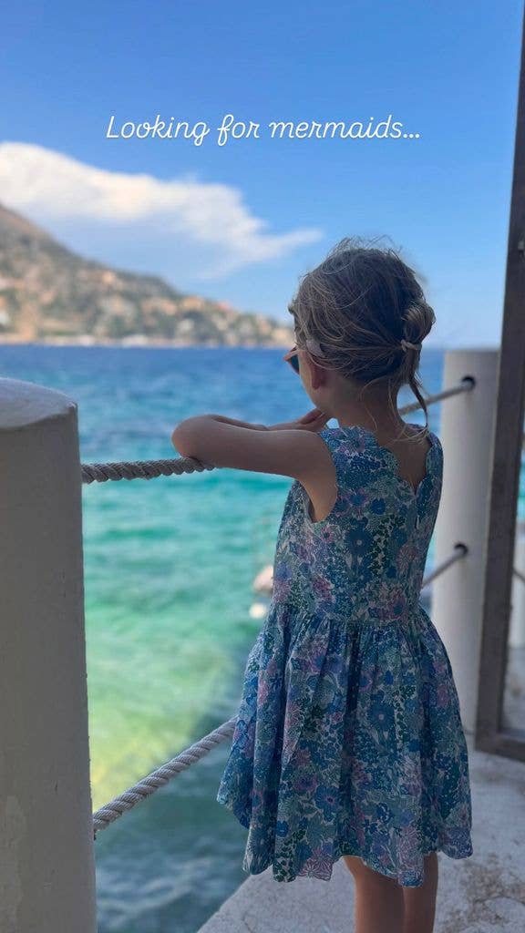 Kitty Spencer's daughter in a sundress looking at the sea
