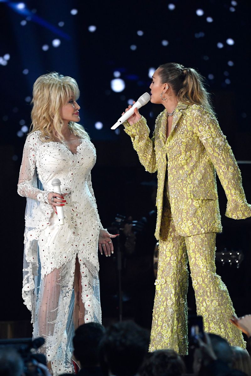 Dolly Parton (L) and Miley Cyrus perform onstage during the 61st Annual GRAMMY Awards