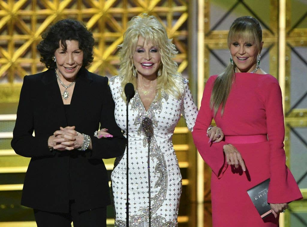 Lily Tomlin (L), Dolly Parton (C) and Jane Fonda speak during the 69th Emmy Awards at the Microsoft Theatre on September 17, 2017 in Los Angeles, California.