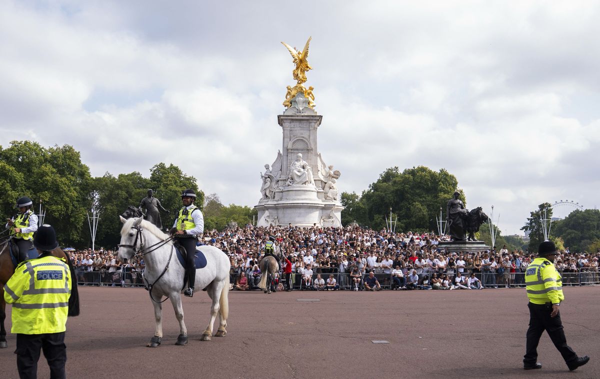 Crowds watch the special musical tribute to Dolly Parton outside Buckingham Palace, one day after the country legend’s death.