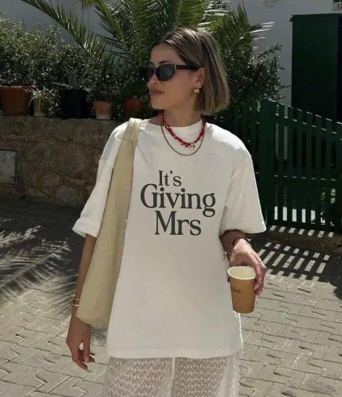 Meghan wore a slogan T-shirt, thought to be purchased from Etsy