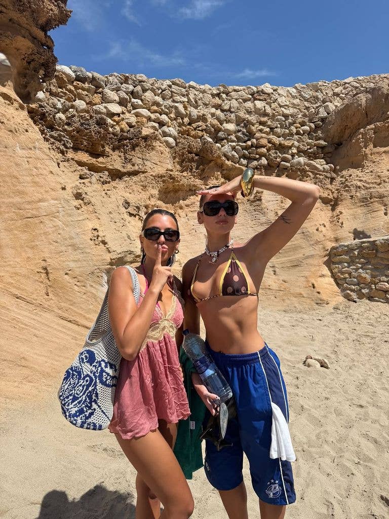 Dua slipped on a brown polka dot bikini top