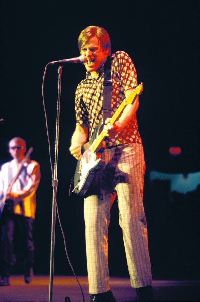 Musician, singer, songwriter, record producer, and photographer Bryan Adams is shown performing on stage during a live concert appearance, Mansfield, Massachusetts, United States, June 1, 1996.