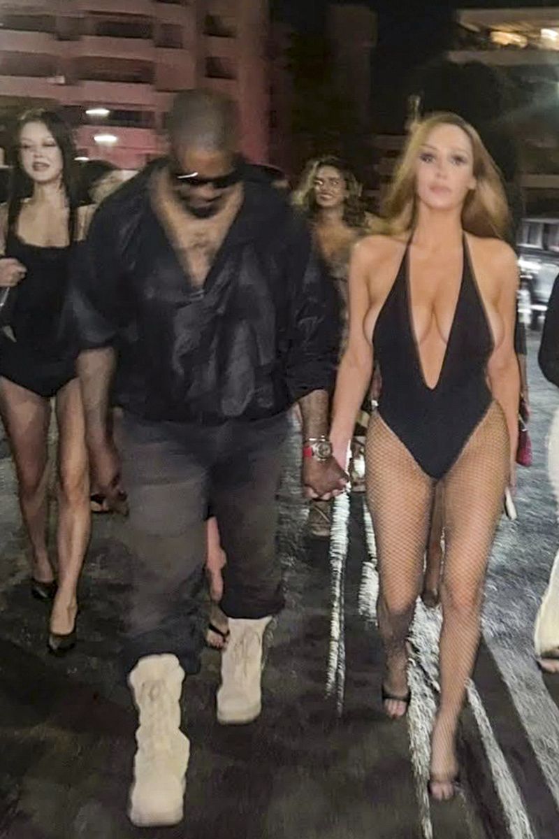 Bianca Censori continued her signature barely-there fashion streak in a dramatic plunging bodysuit, while Kanye West paired an all-black outfit with oversized white boots.