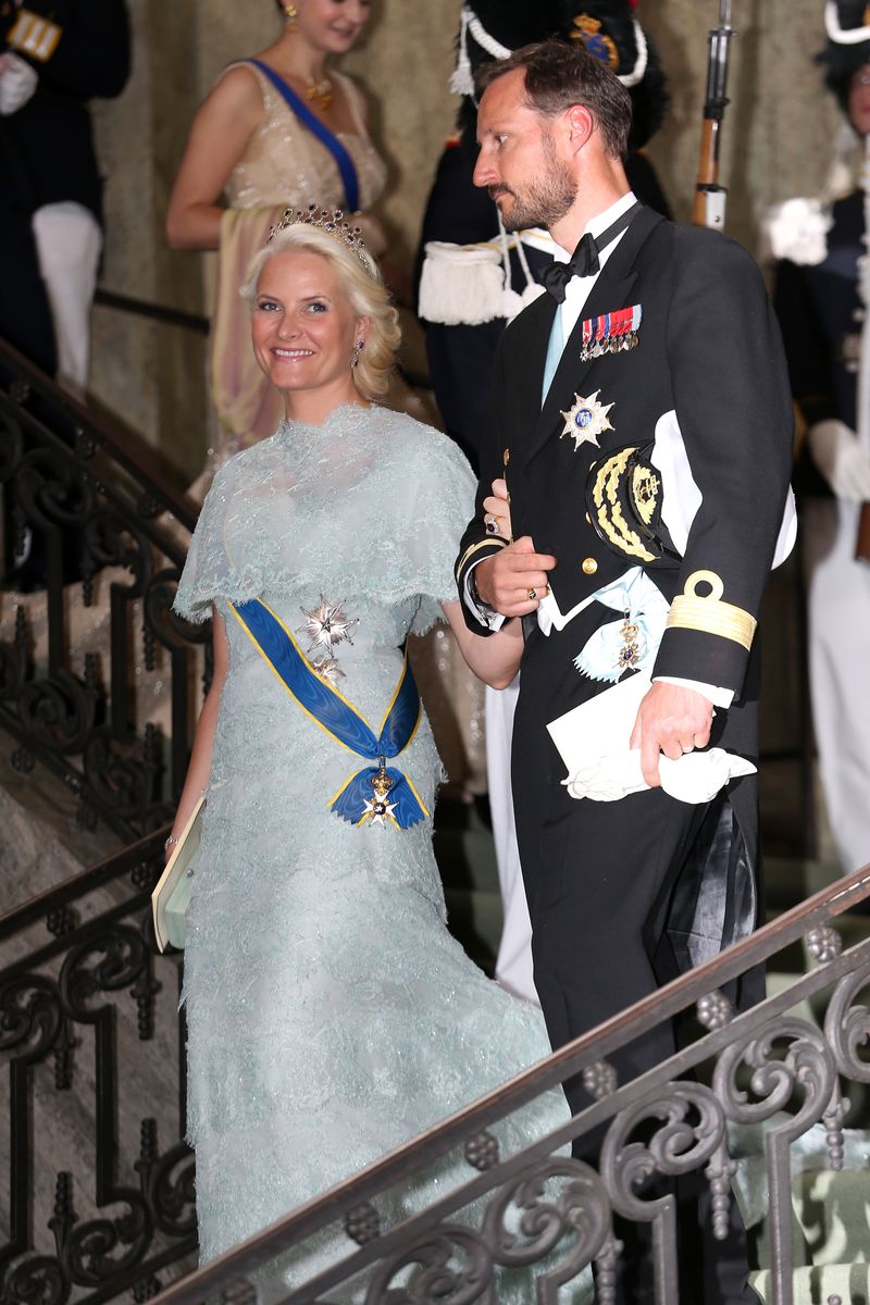 Crown Princess Mette-Marit of Norway and Crown Prince Haakon of Norway depart from the wedding of Princess Madeleine of Sweden and Christopher O'Neill 