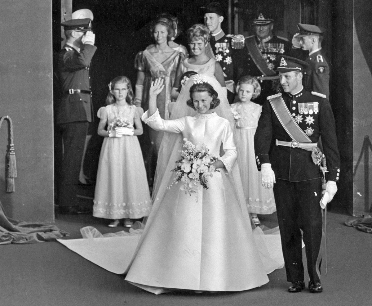 The newlyweds were greeted by cheering crowds outside Oslo Cathedral following their royal wedding in 1968.