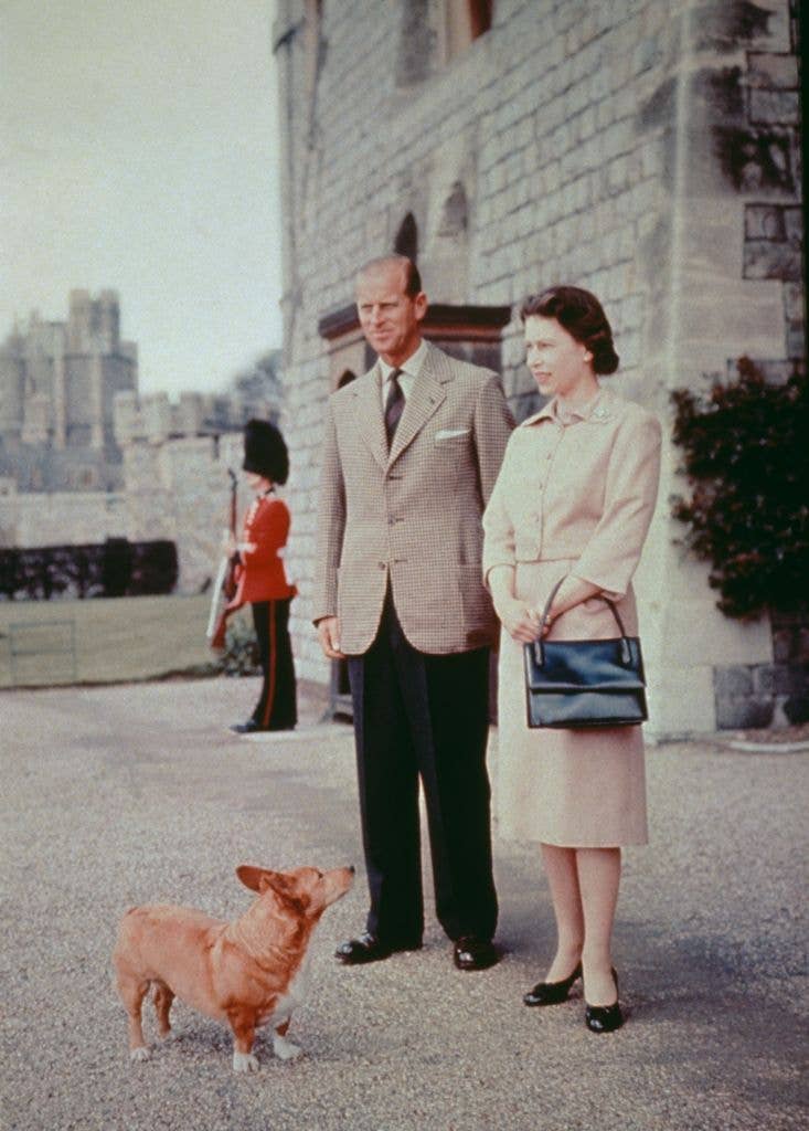 Queen Elizabeth II and Prince Philip with one of their corgis at Windsor Castle in Berkshire