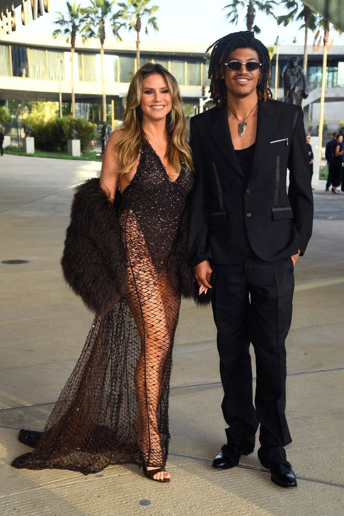 Heidi Klum in black dress and Henry Samuel in suit attend LACMA's Opening Gala for the David Geffen Galleries