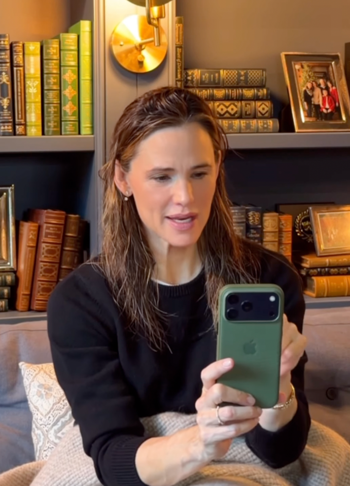 Jennifer spending time in her library, shared via Instagram