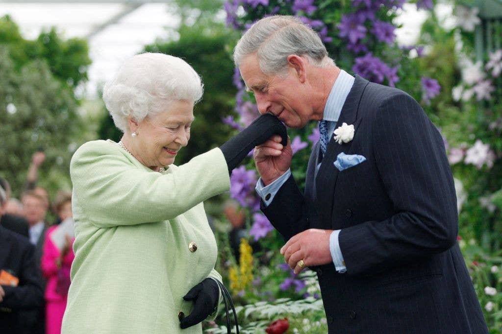 Queen Elizabeth II presents Prince Charles, Prince of Wales with the Royal Horticultural Society's Victoria Medal of Honour during a visit to the Chelsea Flower Show on May 18, 2009 in London. The Victoria Medal of Honour is the highest accolade that the Royal Horticultural Society can bestow.