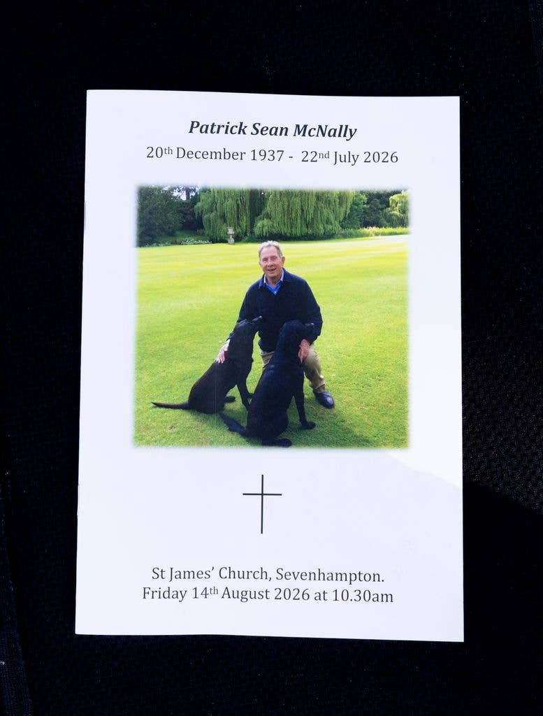 Memorial card for Patrick Sean McNally with a photo of him and two dogs.