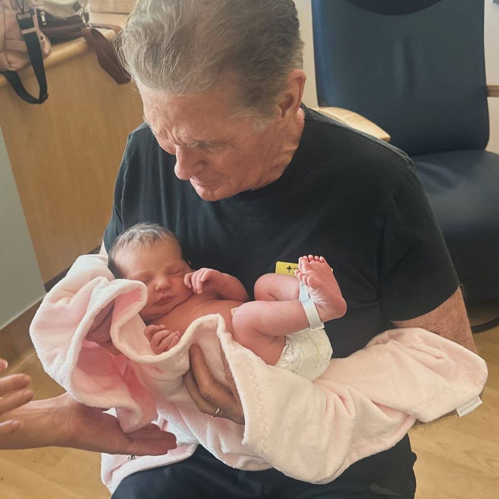 David Hasselhoff holding his granddaughter London