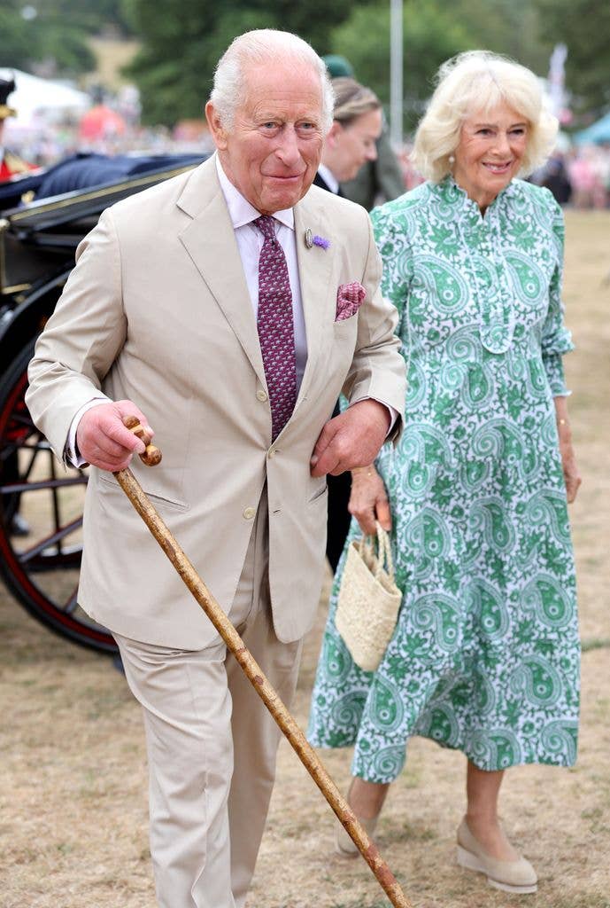 King Charles III and Queen Camilla smile as they arrive for the first RHS Sandringham Flower Show at Royal Sandringham Estate