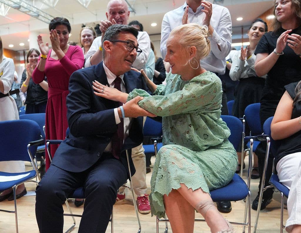 Andy Burnham embraces his wife Marie-France van Heel after being confirmed as the new leader of the Labour Party 
