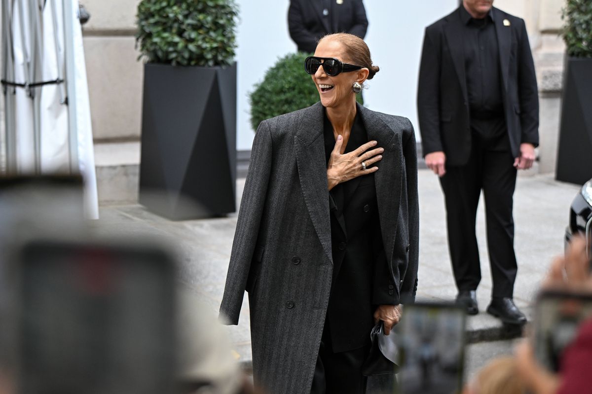The superstar placed a hand over her heart as she acknowledged fans who had gathered to see her during her emotional Paris comeback.