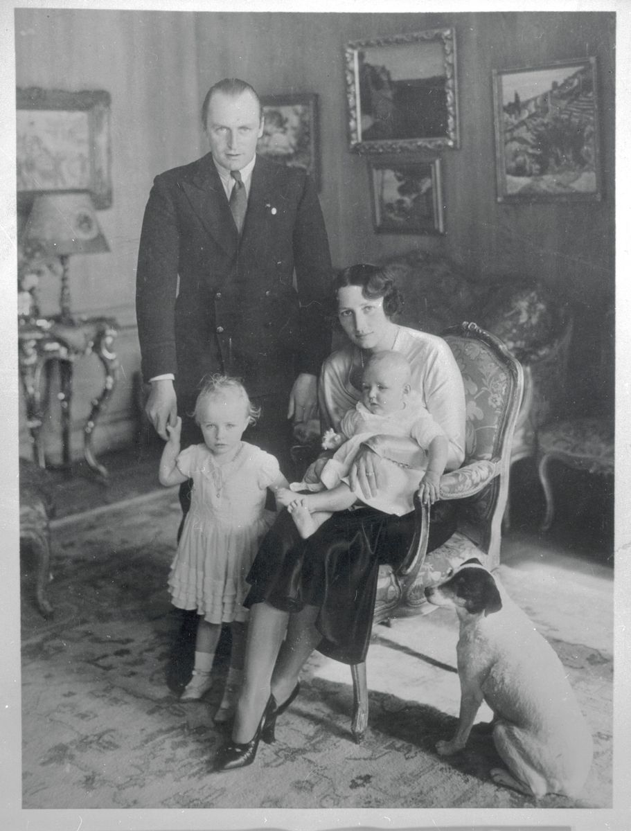 Prince and Princess Olav of Norway are seen here in the drawing room of their home at Skaugum with their children, Princess Ragnhild and princess Astrid