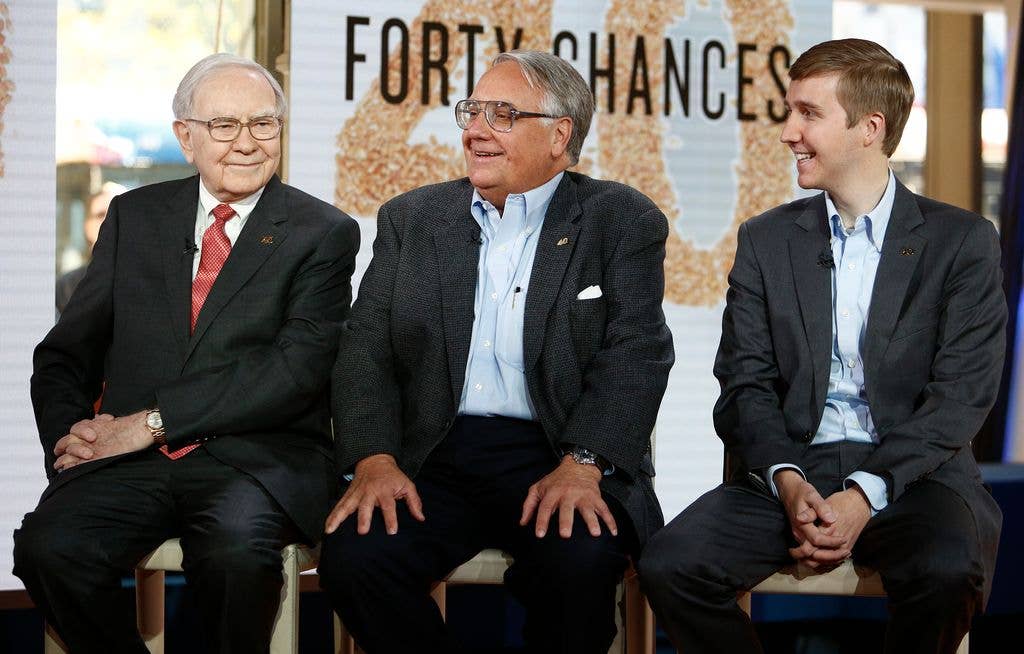 Warren Buffett, Howard G. Buffett and Howard W. Buffett sit together on stools in front of a "Forty Chances" backdrop during a Today show appearance.