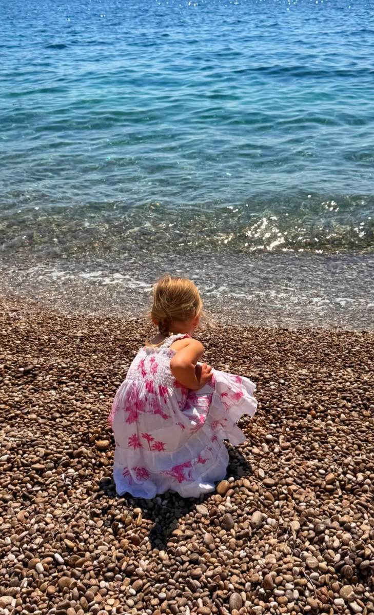 Three-year-old Athena explored the Mediterranean shoreline during the family’s idyllic summer getaway.