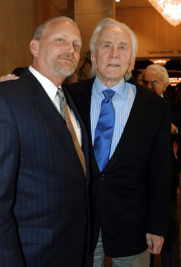 Kirk Douglas (R) and his son Eric (L) arrive for the 38th Annual Publicists Guild of America Awards 23 March 2001 in Beverly Hills, CA. Douglas' son Michael was awarded the Lifetime Achievement Award by the guild. AFP Photo/Lee CELANO