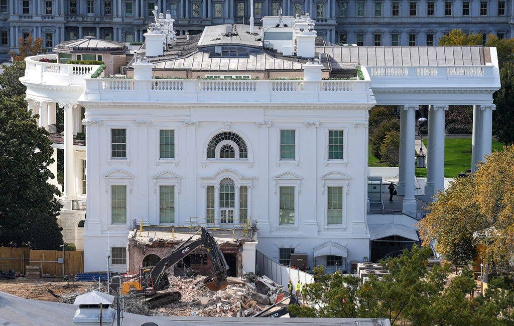 An excavator works to clear rubble after the East Wing of the White House was demolished on October 23, 2025 in Washington, DC. The demolition is part of U.S. President Donald Trump's plan to build a multimillion-dollar ballroom on the eastern side of the White House