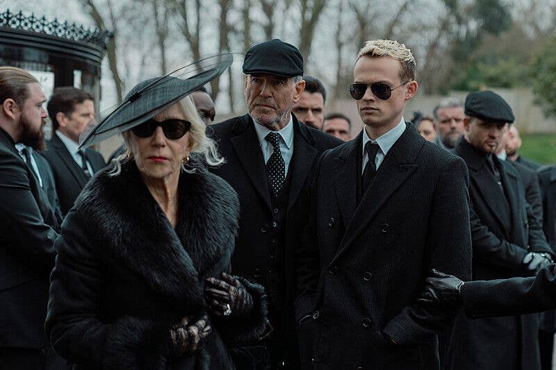 Three people dressed in black