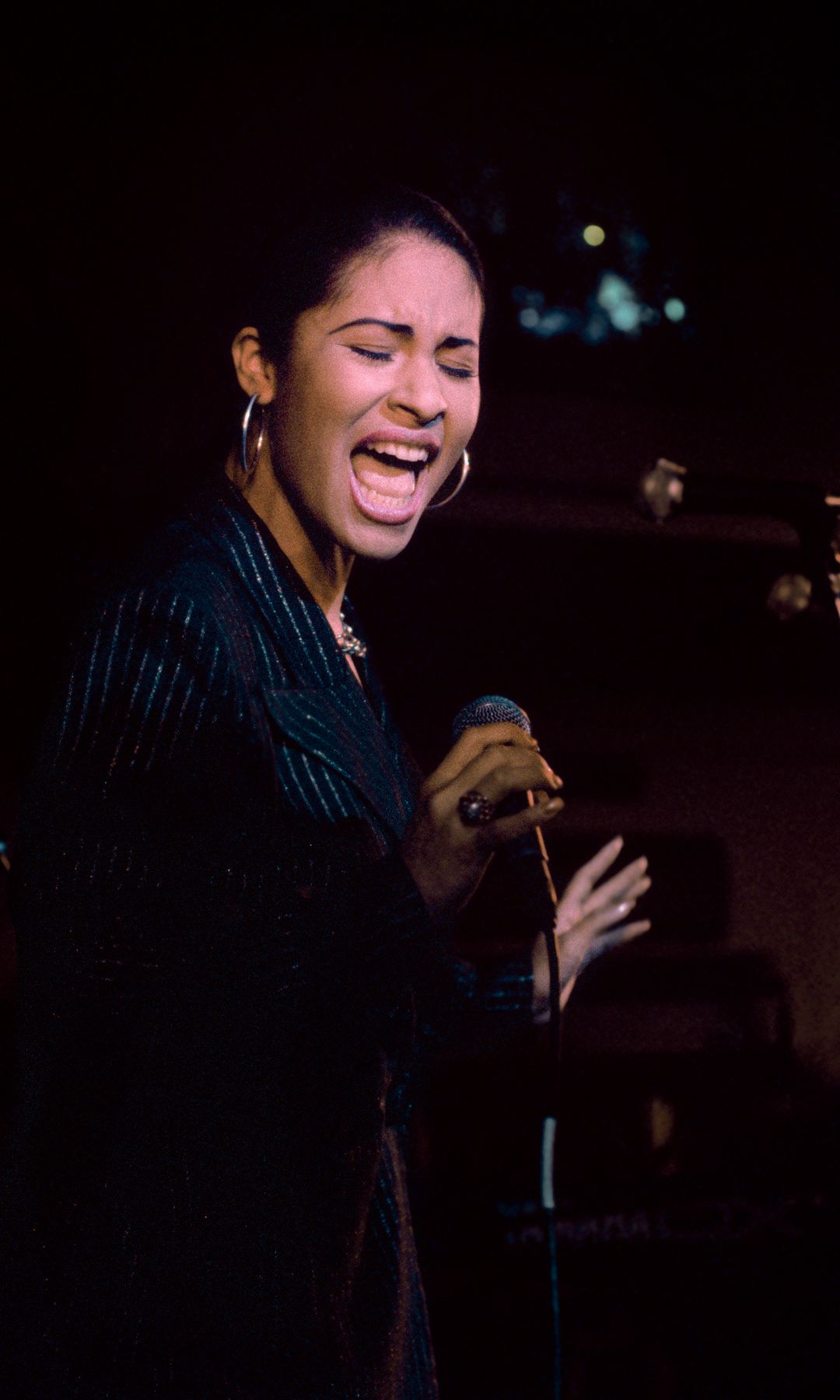 Singer Selena (Quintanilla) performs at the opening of the Hard Rock Cafe on January 12th, 1995 in San Antonio, Texas.  (Photo by Larry Busacca/Getty Images)