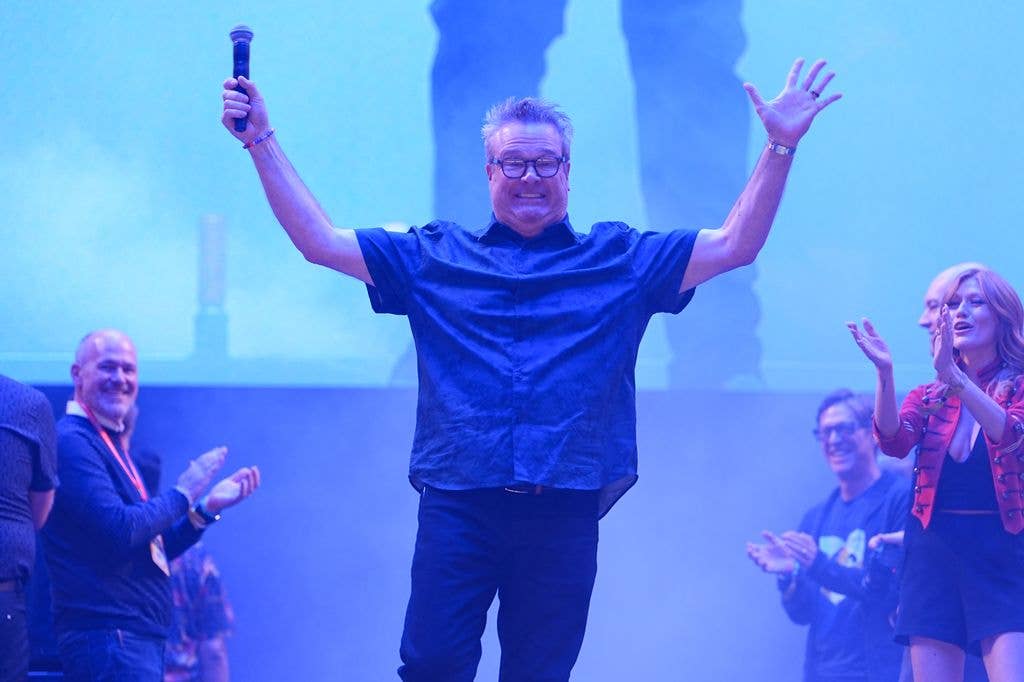 eric stonestreet smiling hands in the air