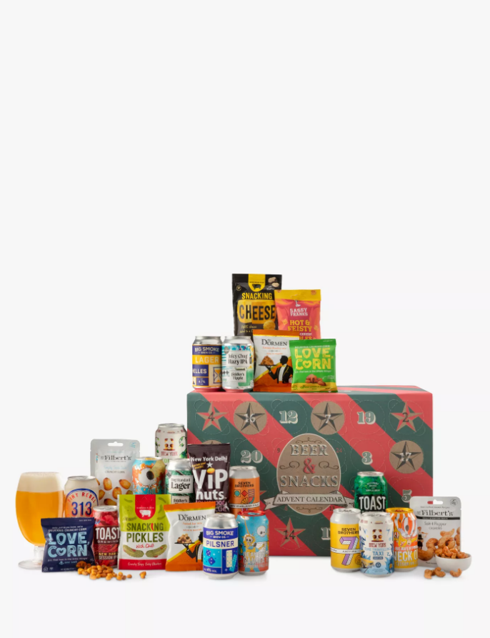 John Lewis Beer & Snacks Advent Calendar with assorted snacks and drinks, including cheese, corn, and beer, arranged on a table.