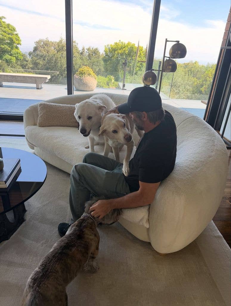 Jim Curtis enjoying a happy moment with Jennifer's dogs