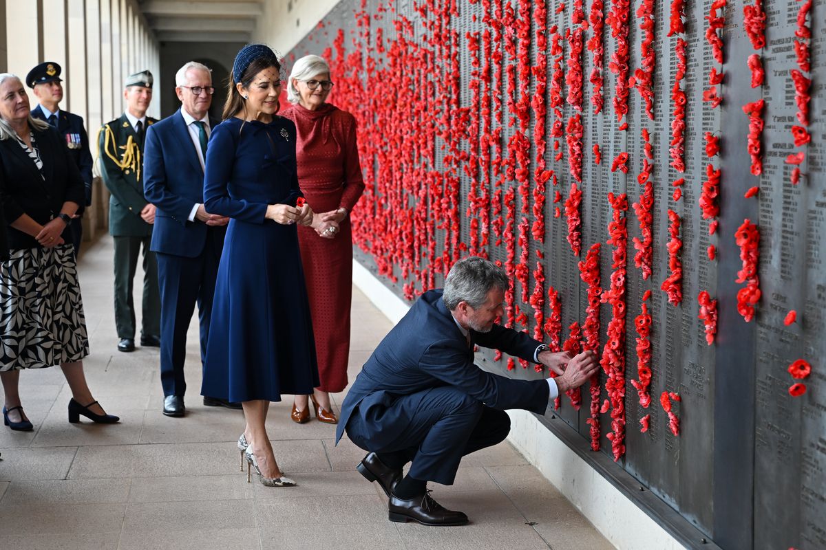 Queen Mary wore a sophisticated dark blue ensemble as she and King Frederik paid tribute at the Tomb of the Unknown Soldier during their official visit to her native Australia on March 16, 2026.