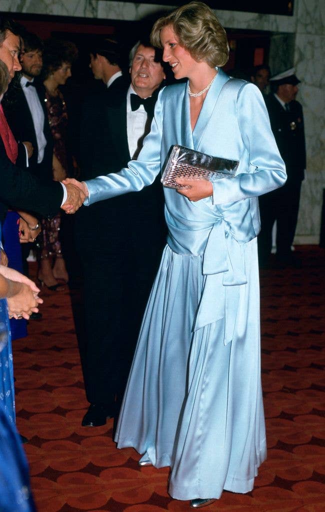 Diana, Princess Of Wales,  Pregnant With Her Second Son, Prince Harry,  Attending The Film Premiere Of 'Indiana Jones And The Temple of Doom' In Leicester Square Just Weeks Before His Birth. She is wearing a pale blue Catherine Walker gown